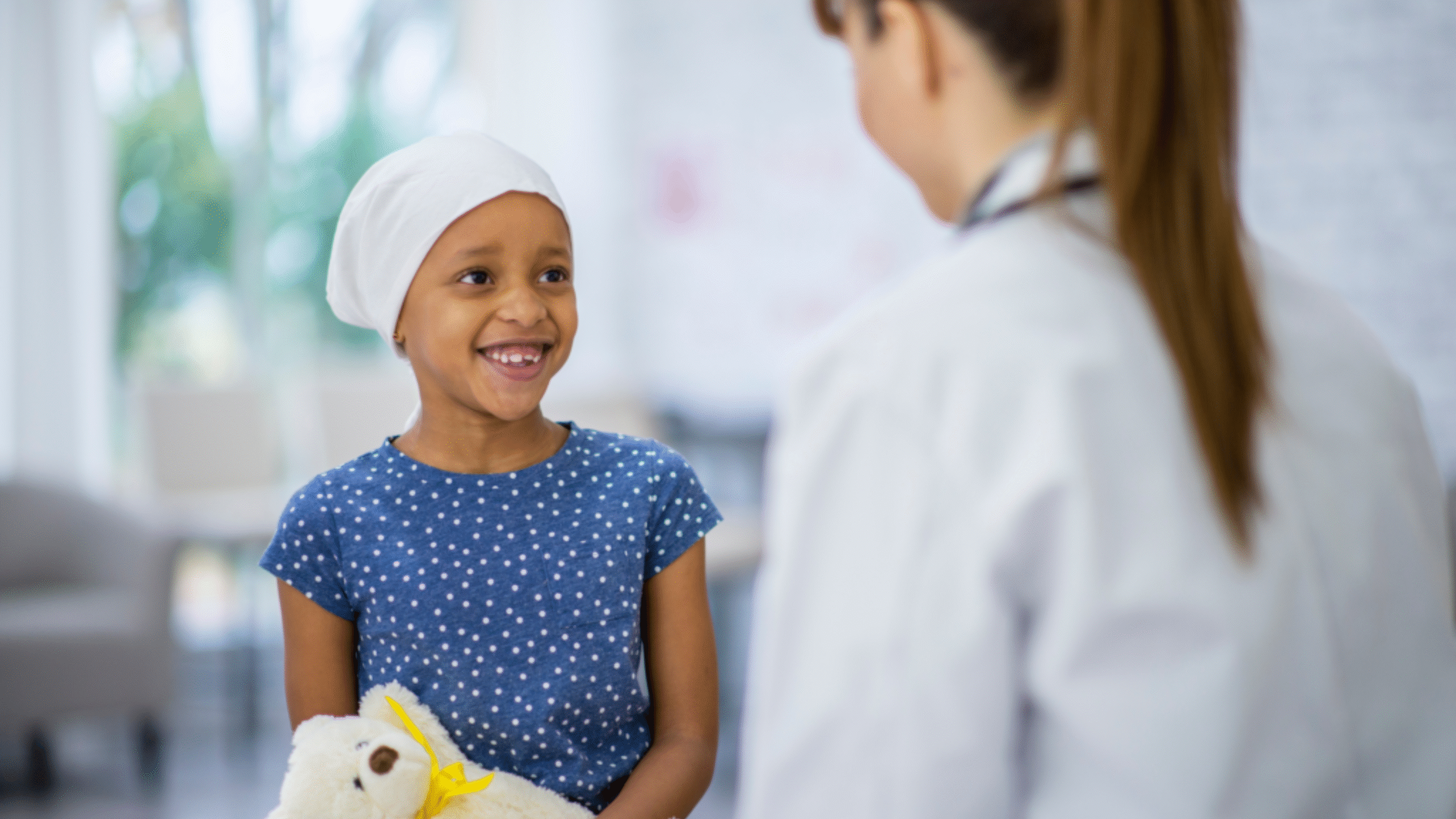 Doctor speaks with pediatric patient
