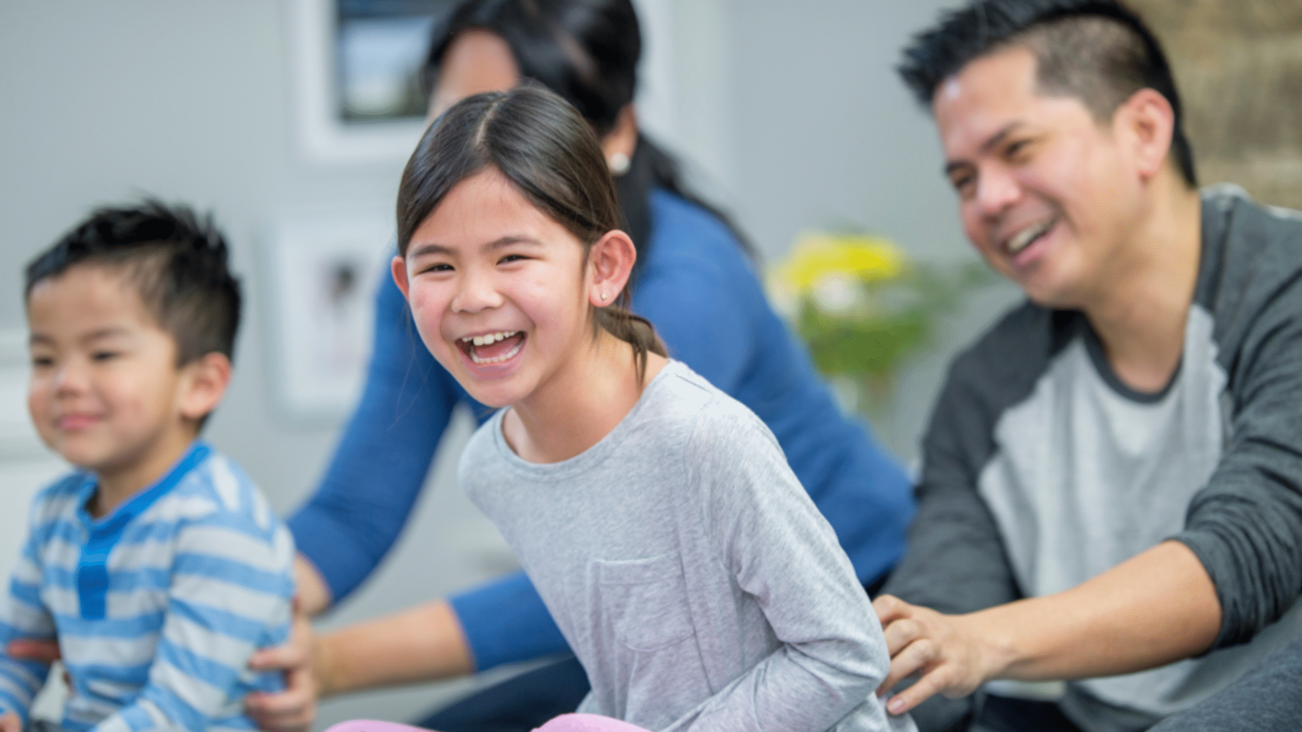 Child laughing at parent's joke