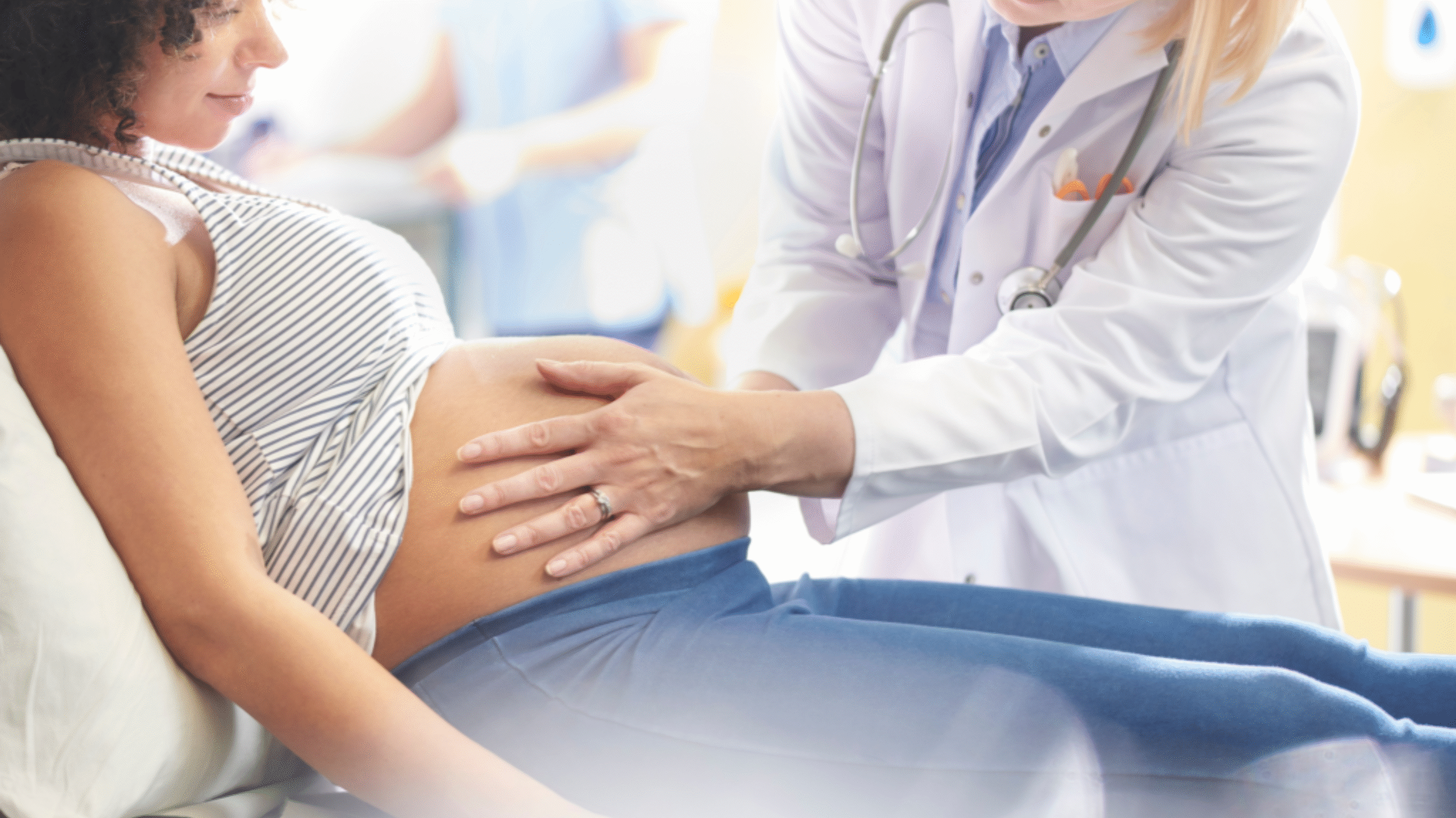 pregnant women being checked out in the ER by physician