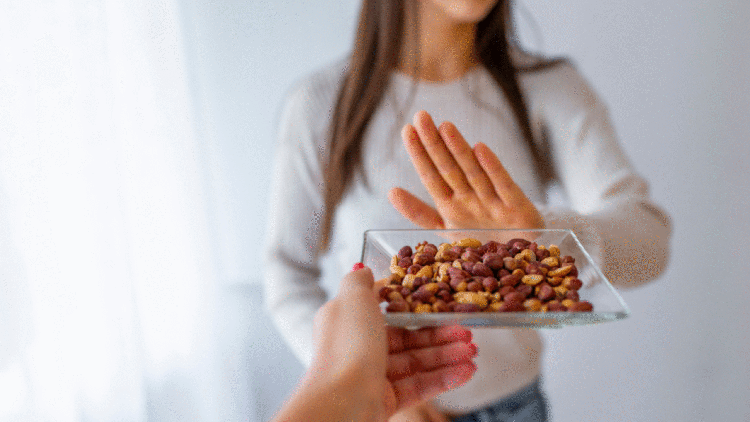 woman with allergy says no to peanuts