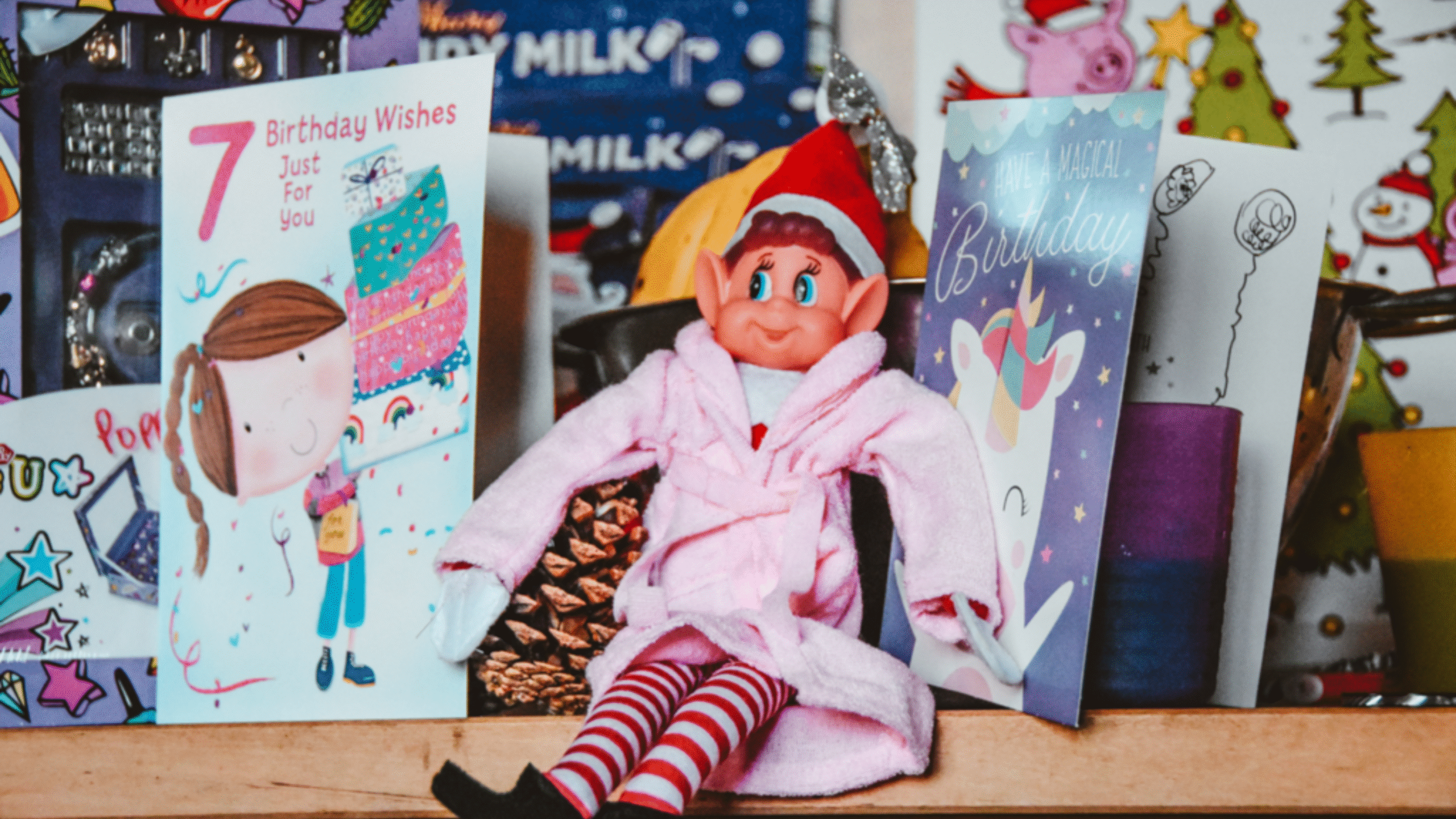 Elf on the Shelf in a pink robe