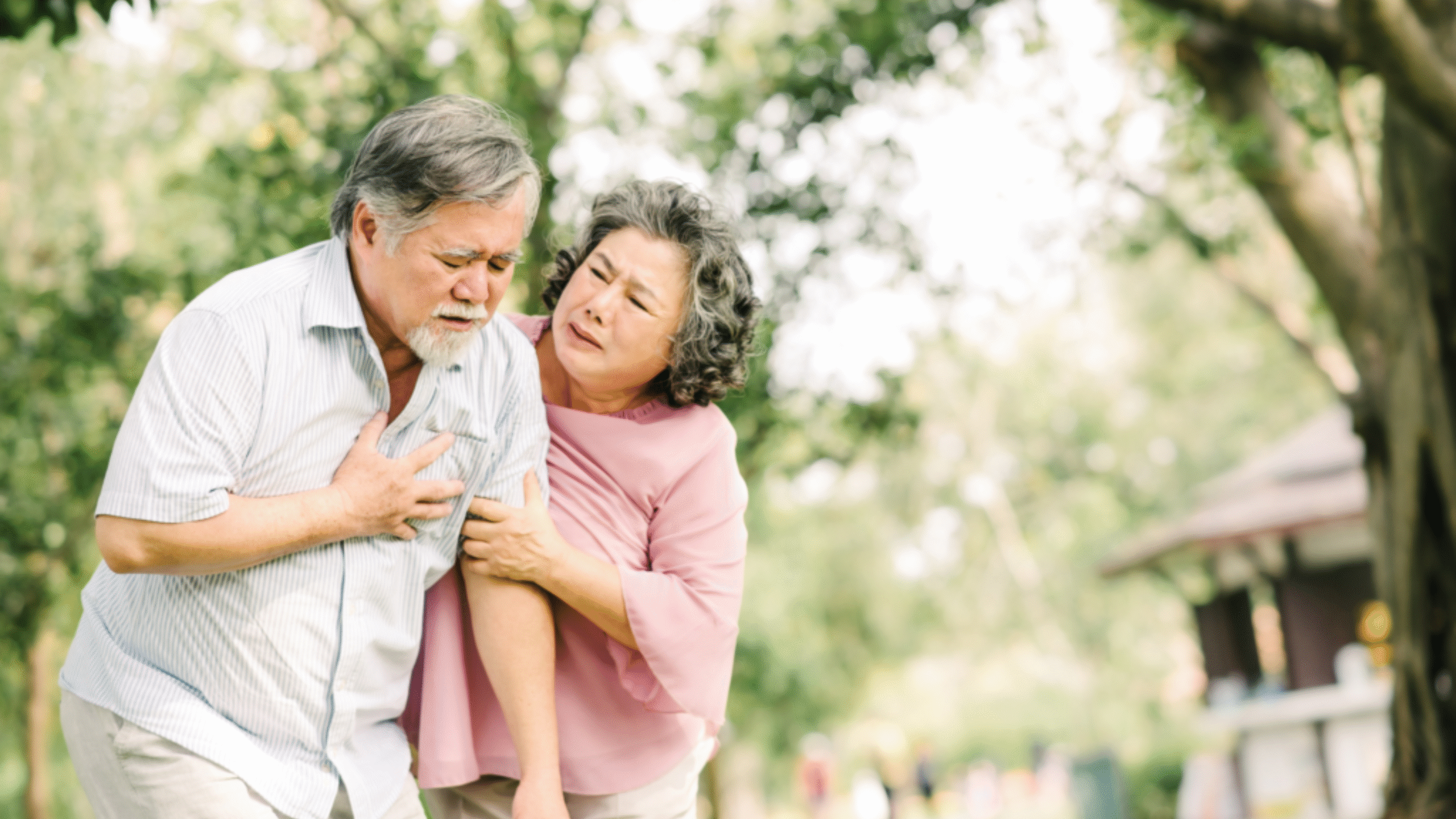 Lady helps her husband who is having heart challenges go sit down