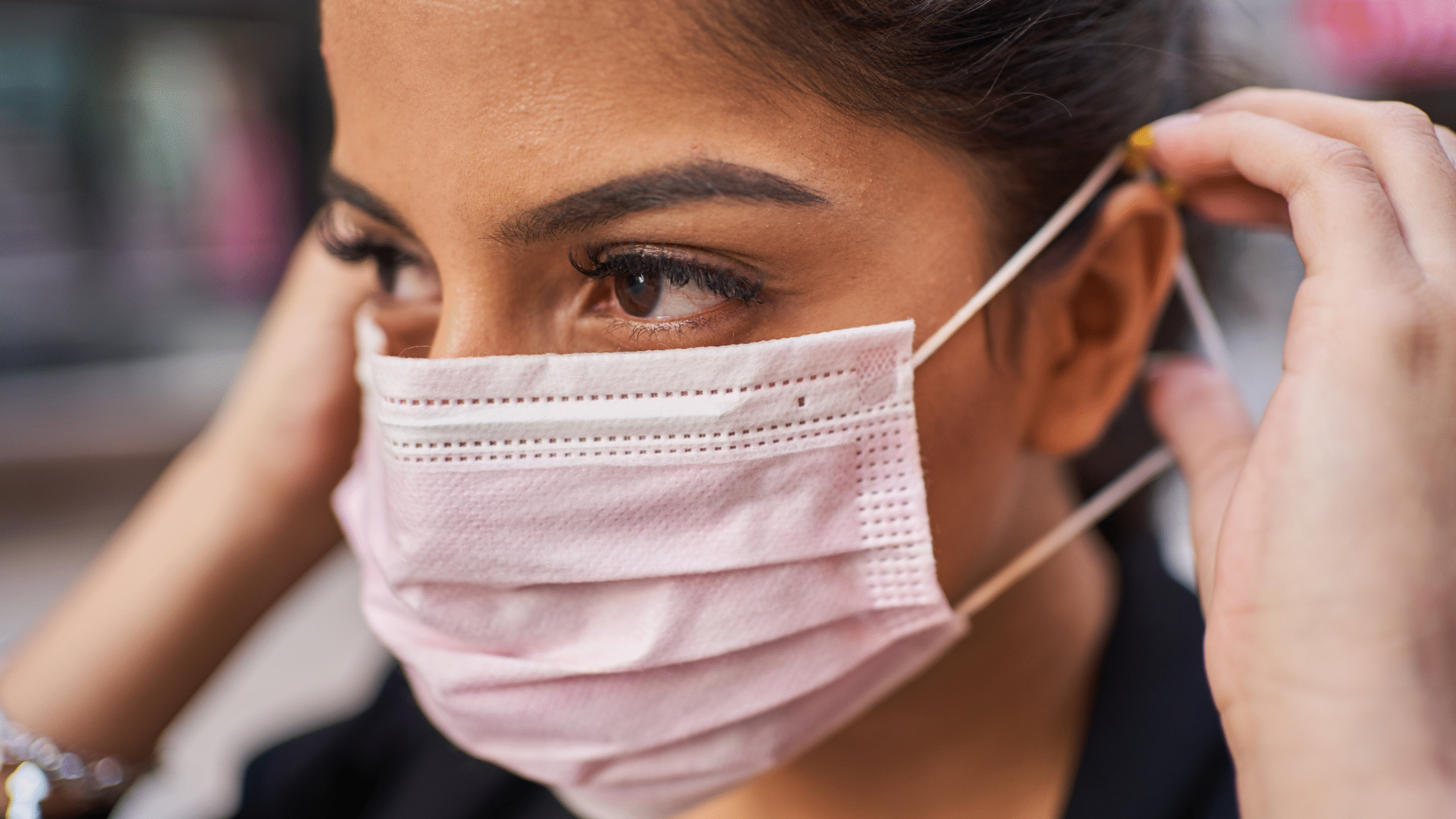 lady with pink COVID mask on