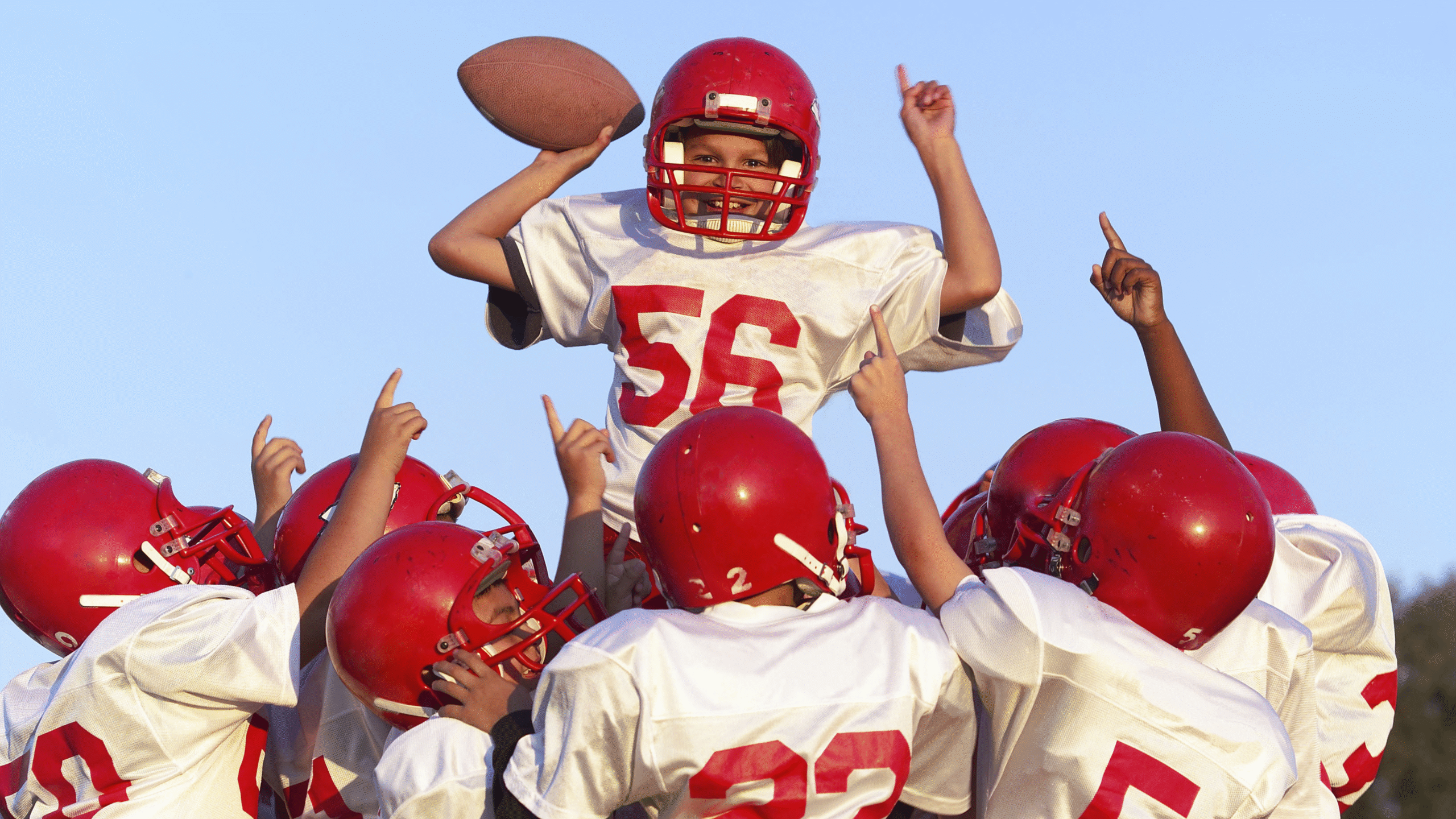 youth football team celebrates win