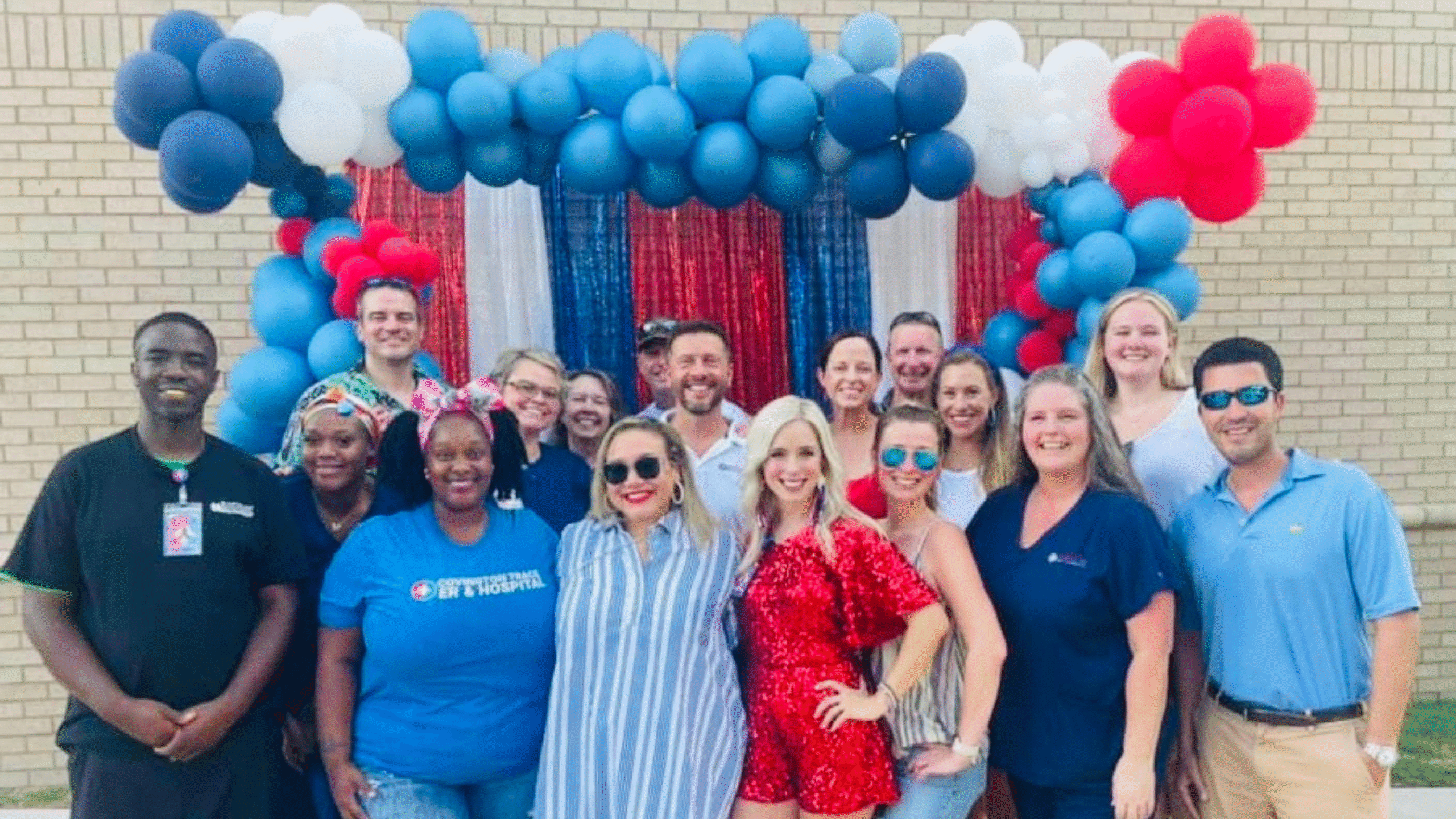Covington Trace ER & Hospital team celebrates one year anniversary in front of balloons and streamer