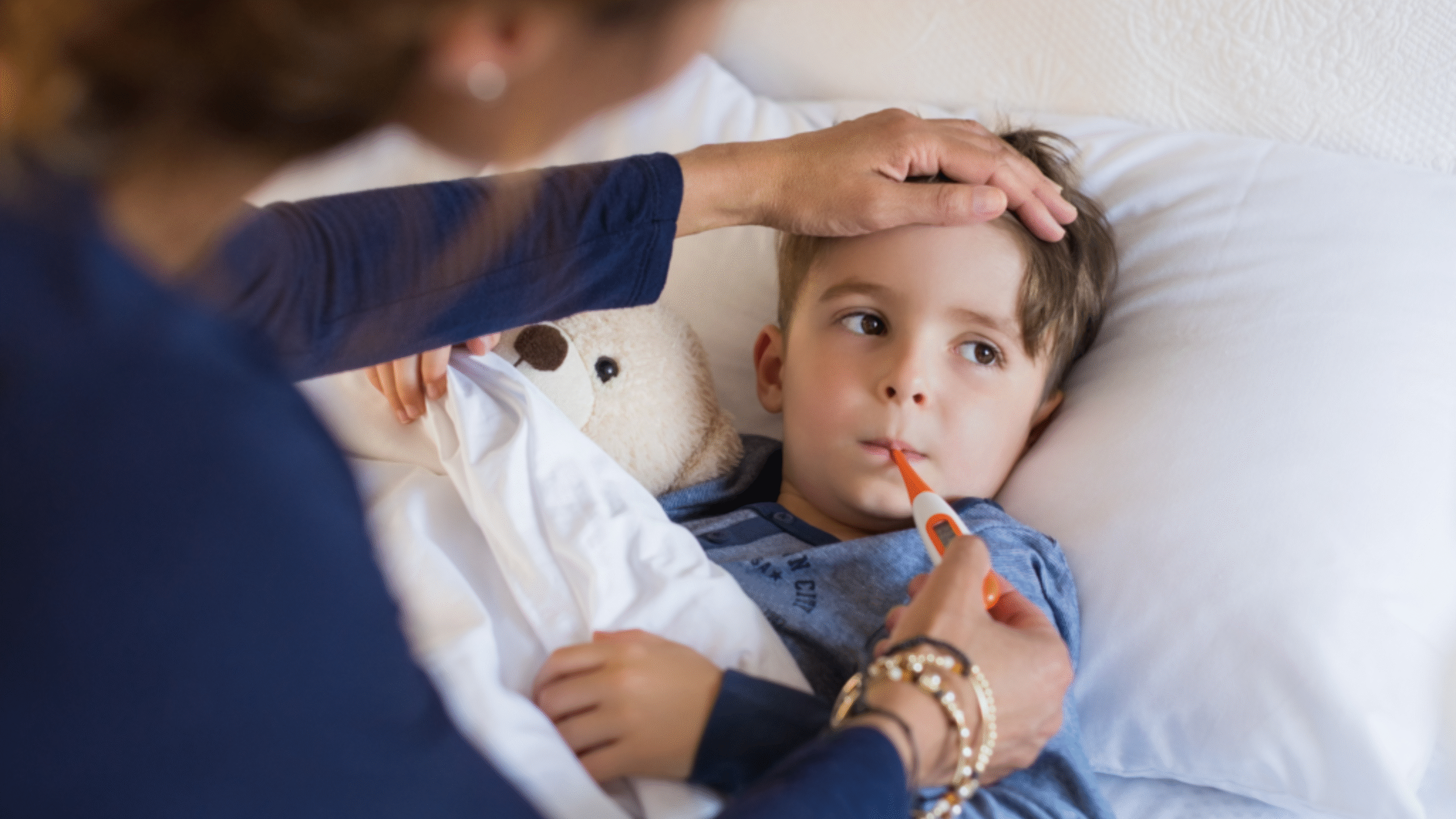 child sick in bed