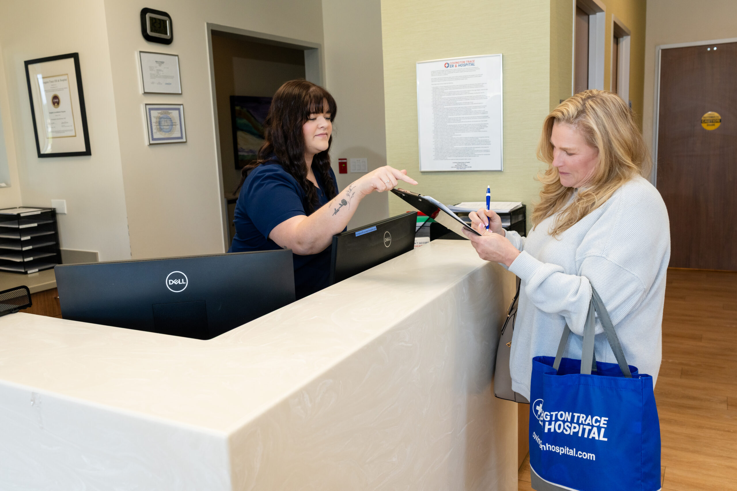 A woman checking in to Covington Trace ER & Hospital.